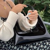 Bolso de hombro tipo axila con forma de albóndigas de cuero